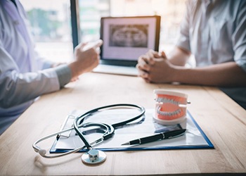 a dentist consulting with a patient 