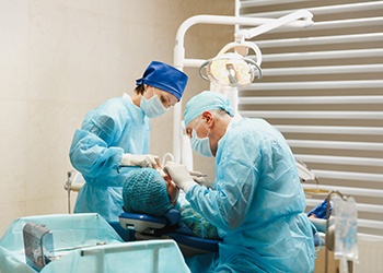 a dentist placing dental implants