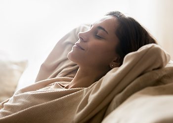 a woman resting on a couch