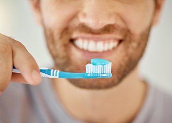 a person brushing their teeth