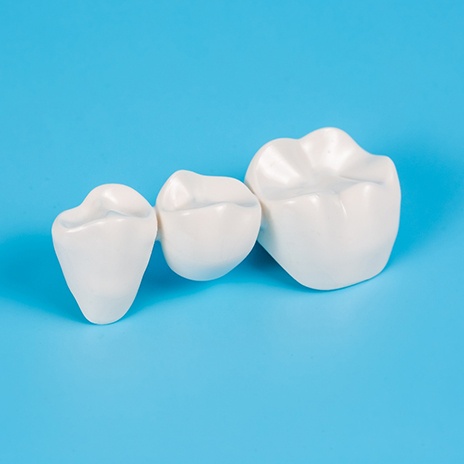 Closeup of dental bridge with light blue background