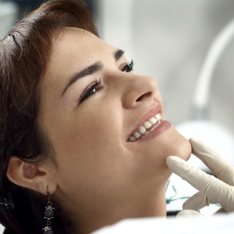Woman grinning in dental chair