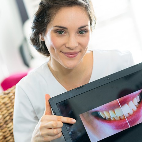 a patient pointing to her smile makeover treatment plan