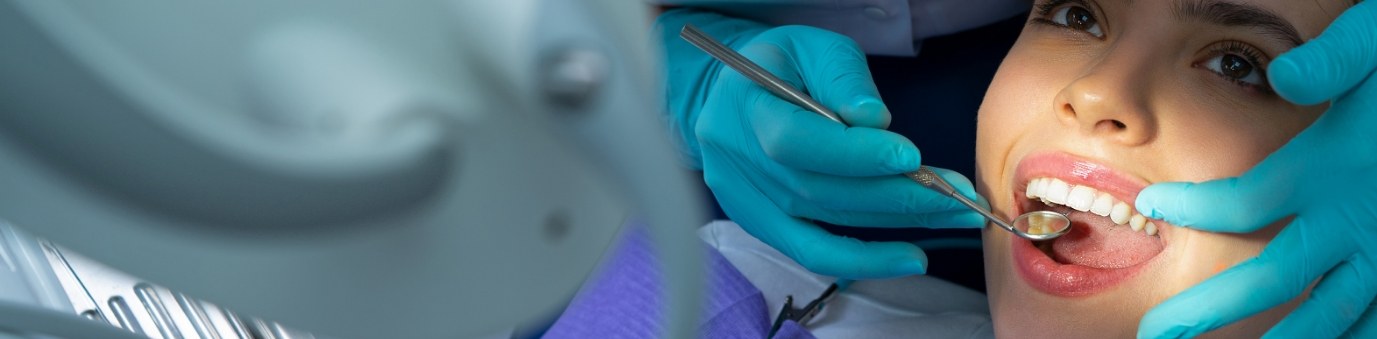 Woman receiving dental treatment