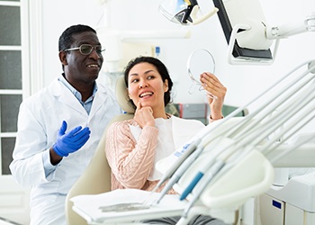 Woman pointing to her teeth
