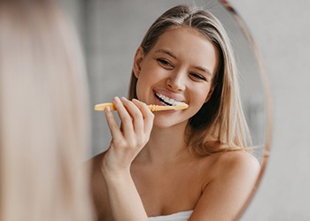 Woman brushing her teeth