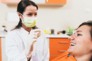 Woman in dental chair after a tooth extraction